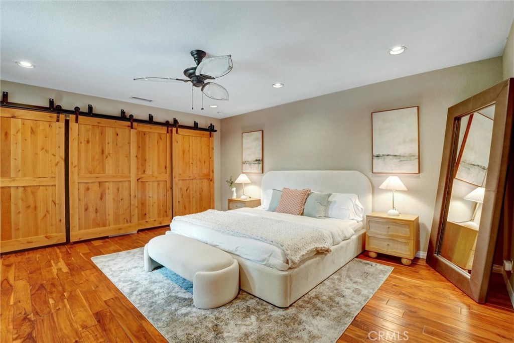 14955 Haynes Street Van Nuys, CA 91411 - Photo 17 of 35 a bedroom with a large bed and a rug