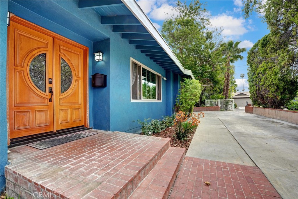 14955 Haynes Street Van Nuys, CA 91411 - Photo 2 of 35 a backyard of a house with seating space
