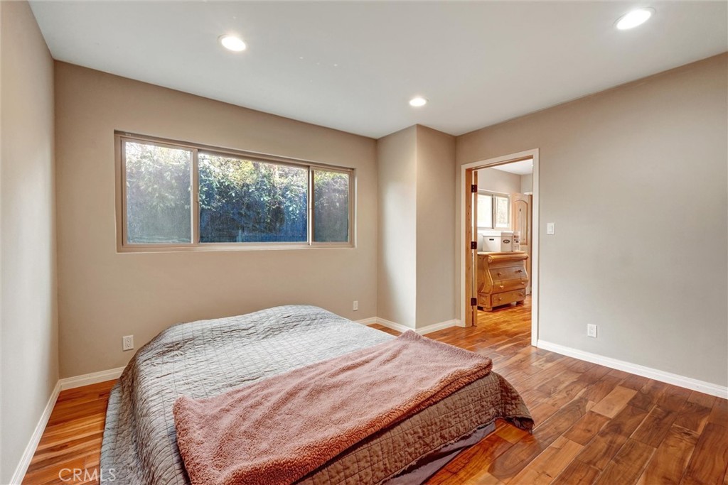 14955 Haynes Street Van Nuys, CA 91411 - Photo 22 of 35 a bedroom with a bed and a window