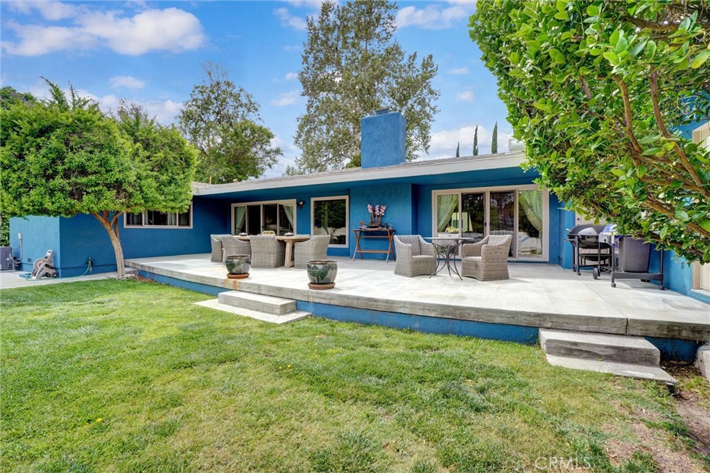 14955 Haynes Street Van Nuys, CA 91411 - Photo 26 of 35 a view of a house with a yard patio and swimming pool