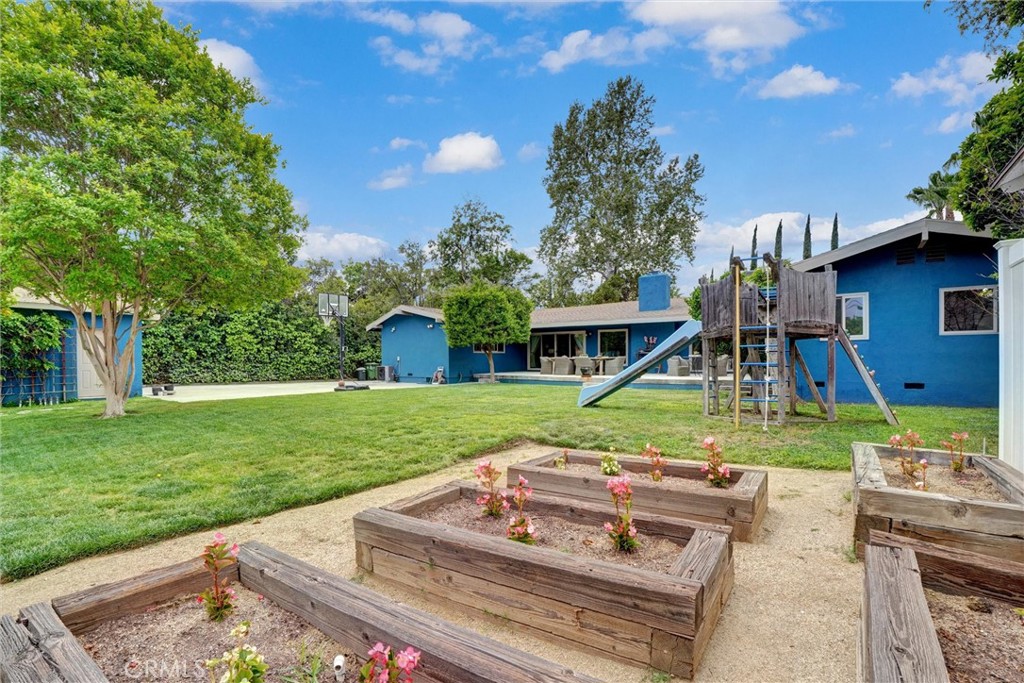 14955 Haynes Street Van Nuys, CA 91411 - Photo 30 of 35 a front view of a house with garden