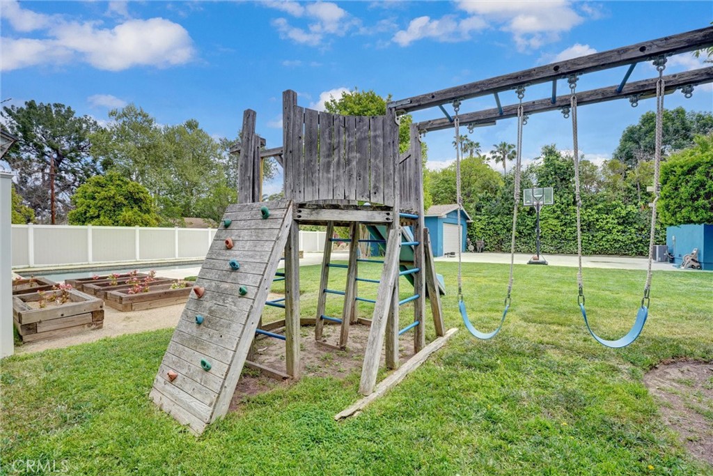 14955 Haynes Street Van Nuys, CA 91411 - Photo 32 of 35 swimming view of a backyard with a garden and plants