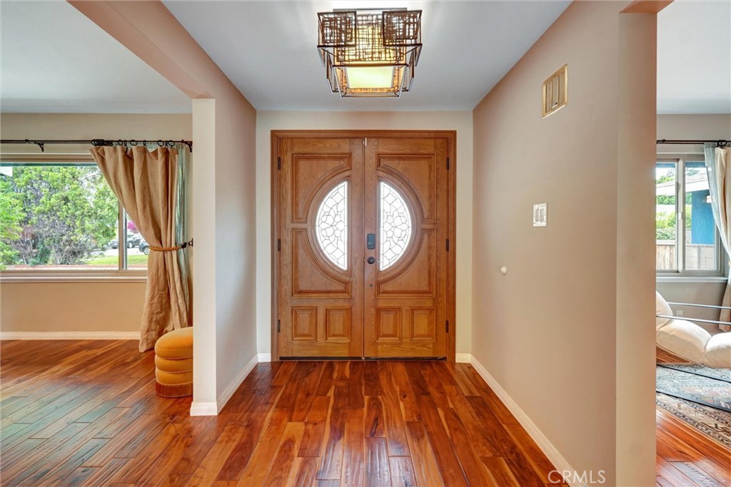 14955 Haynes Street Van Nuys, CA 91411 - Photo 4 of 35 a view of empty room with wooden floor and fan