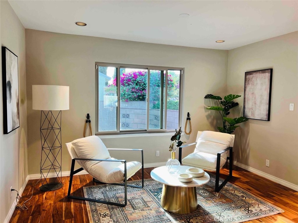 14955 Haynes Street Van Nuys, CA 91411 - Photo 5 of 35 a living room with furniture and a potted plant
