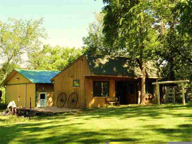 1373 South Snipe Hollow Road Elizabeth, IL 61028 - Photo 11 of 12 a view of a swimming pool with a garden and trees