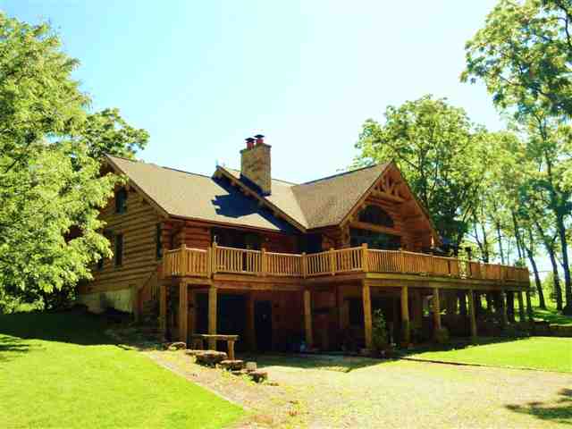 1373 South Snipe Hollow Road Elizabeth, IL 61028 - Photo 2 of 12 a front view of a house with a yard