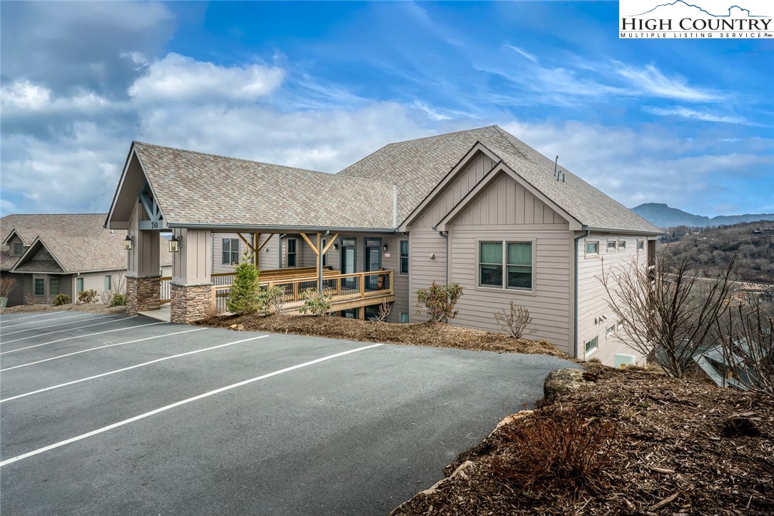 240 Ridgeline Drive, Unit D Sugar Mountain, NC 28604 - Photo 1 of 30 a view of a house with a patio