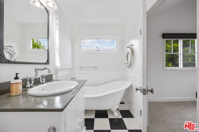 a view of a hallway with washer and dryer