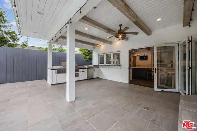 an empty room with furniture and a fireplace