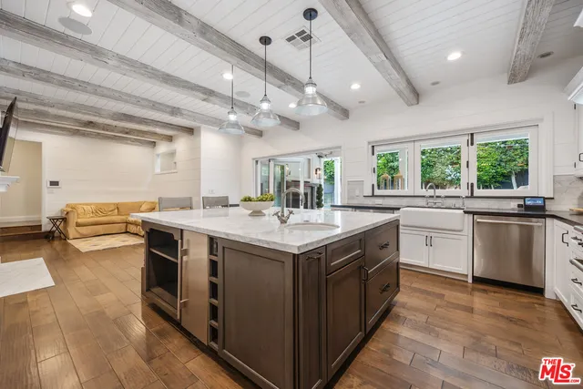 a kitchen with a stove and a sink