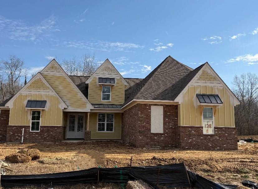 a view of house with a yard