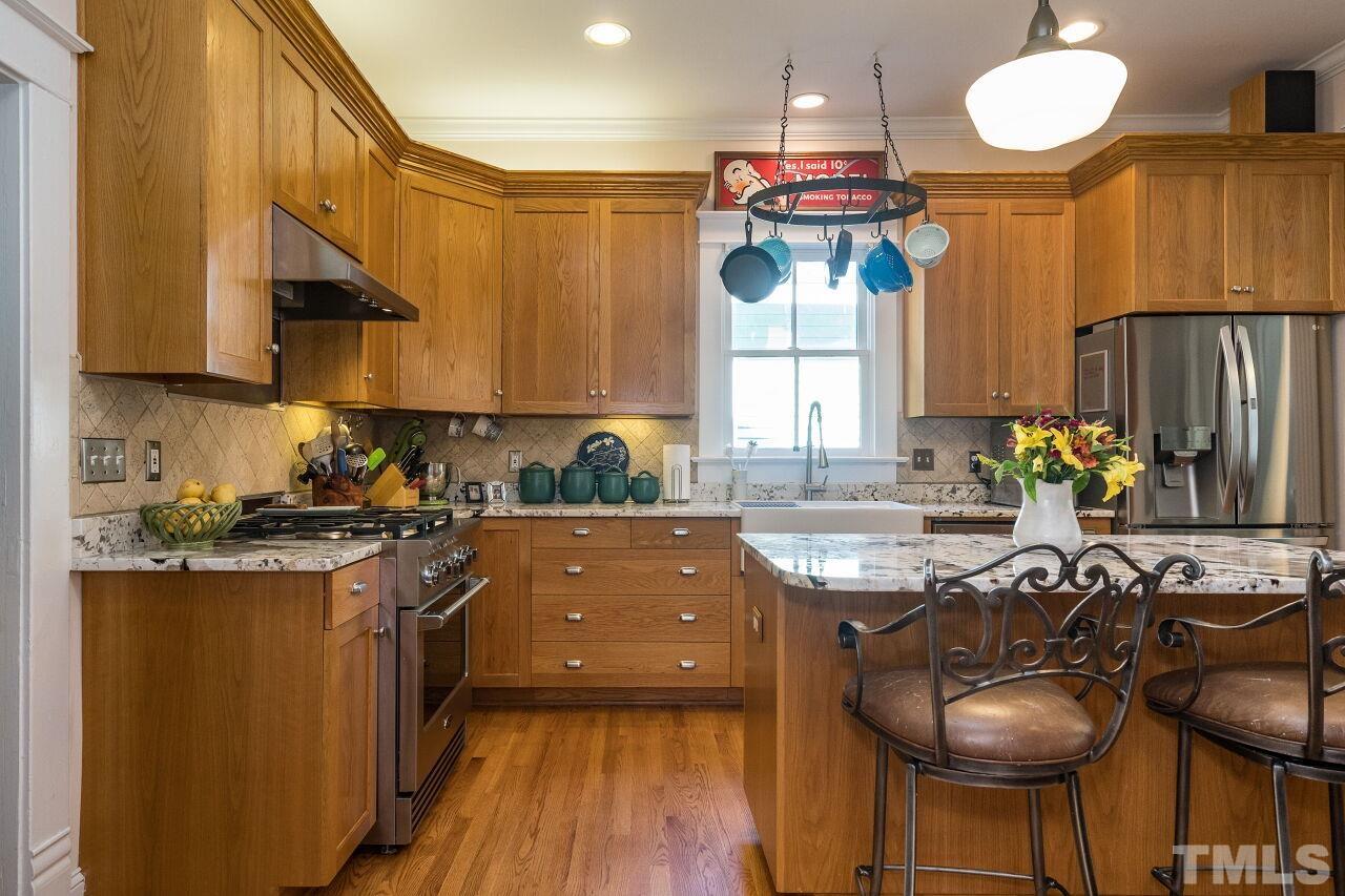 1218 Filmore Street Raleigh, NC 27605 - Photo 11 of 38 a kitchen with counter top space appliances and cabinets