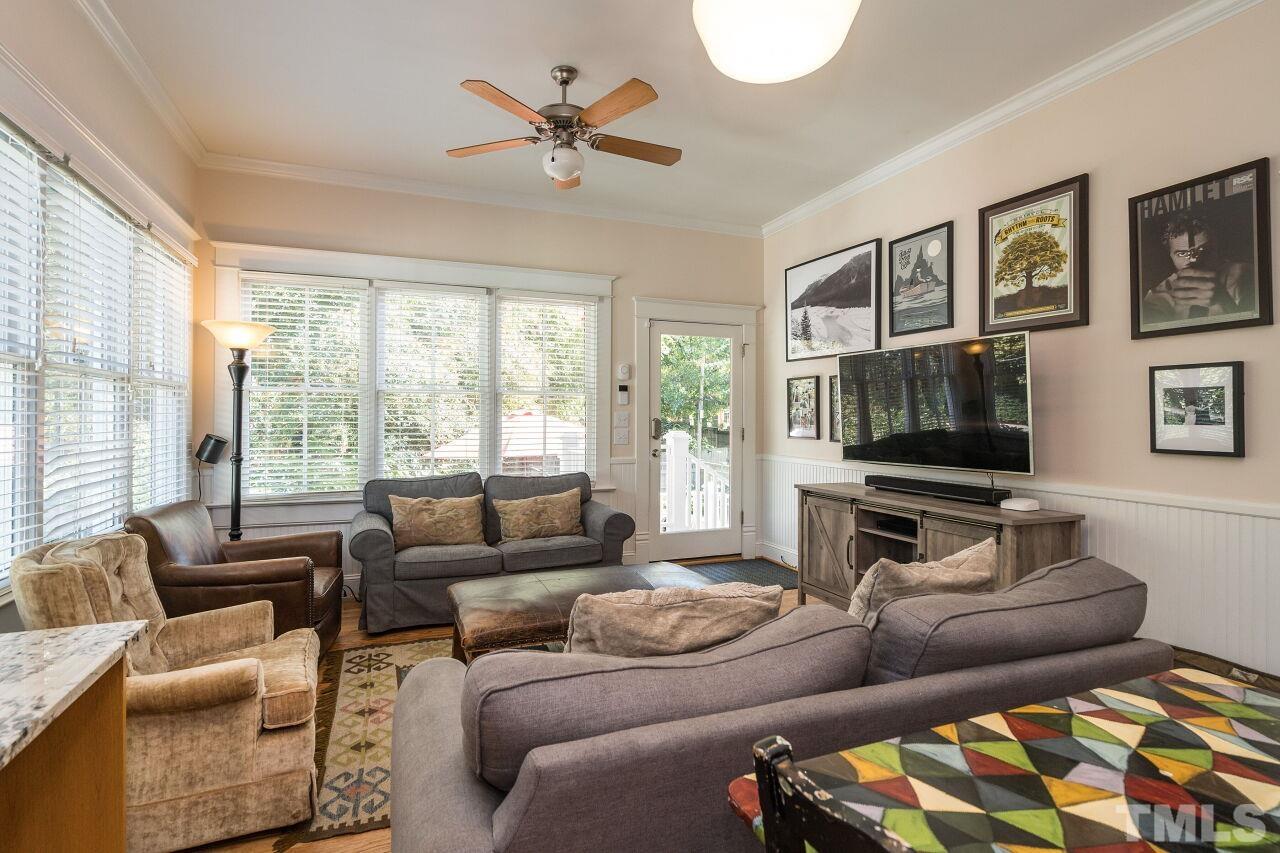 1218 Filmore Street Raleigh, NC 27605 - Photo 15 of 38 a living room with furniture and a flat screen tv