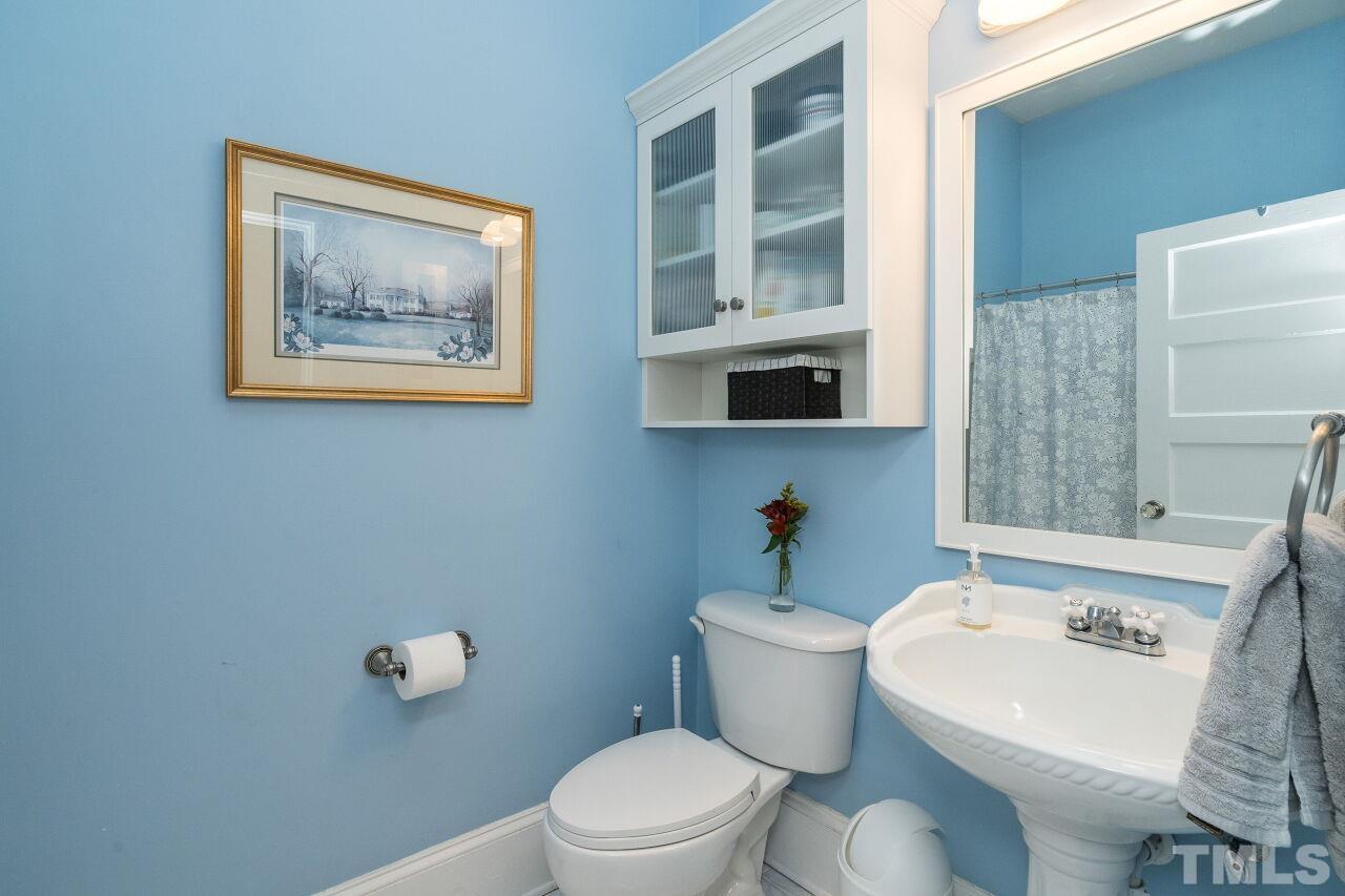 1218 Filmore Street Raleigh, NC 27605 - Photo 19 of 38 a white bath tub sitting next to a white toilet