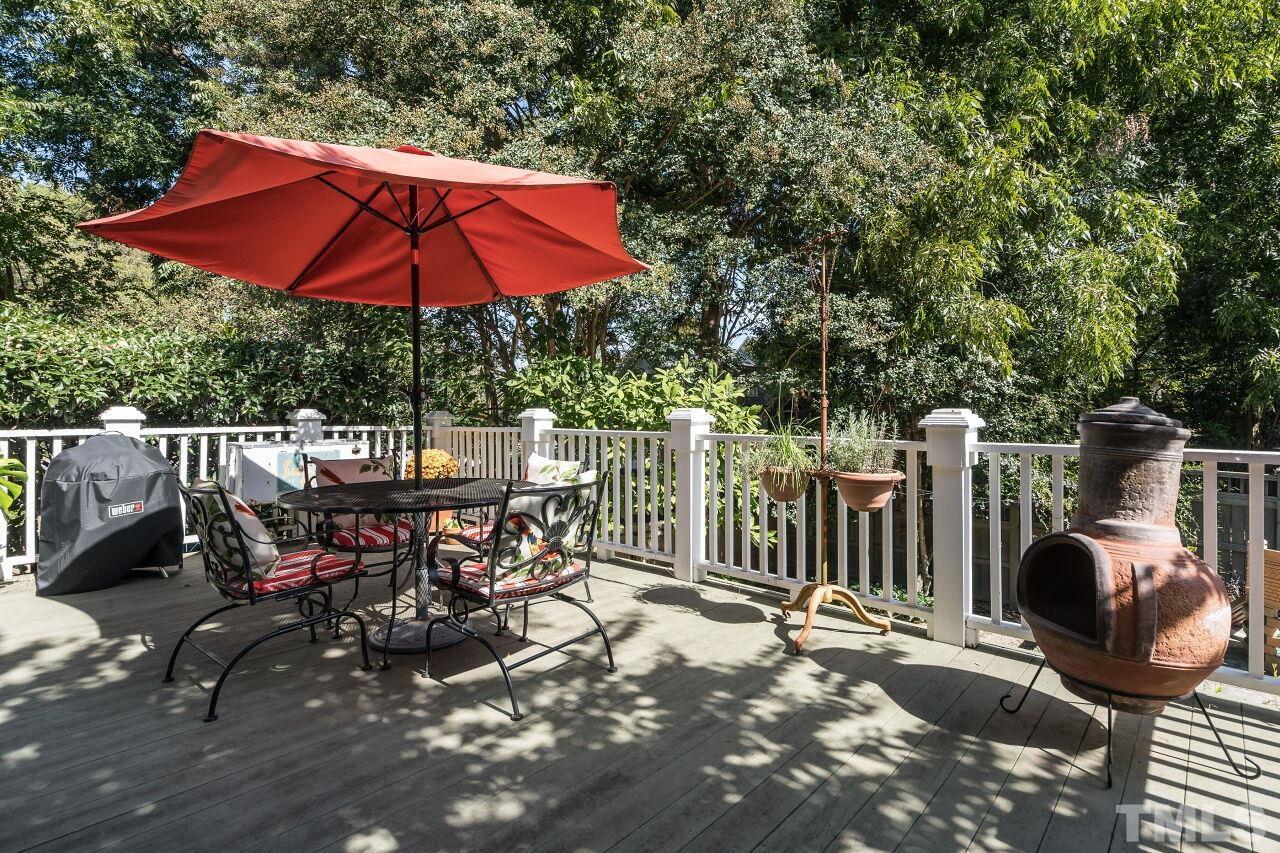1218 Filmore Street Raleigh, NC 27605 - Photo 29 of 38 a view of backyard with seating space and trees