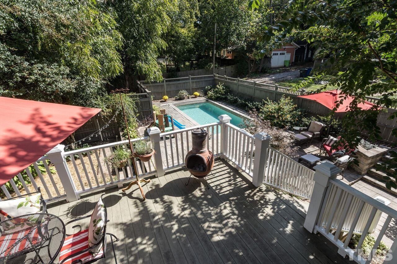 1218 Filmore Street Raleigh, NC 27605 - Photo 3 of 38 a view of balcony with wooden floor and outdoor seating