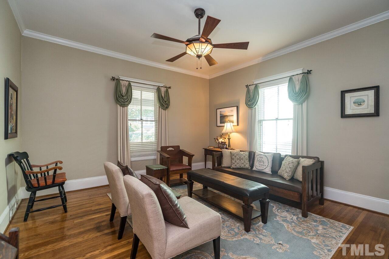 1218 Filmore Street Raleigh, NC 27605 - Photo 8 of 38 a living room with furniture a window and a potted plant