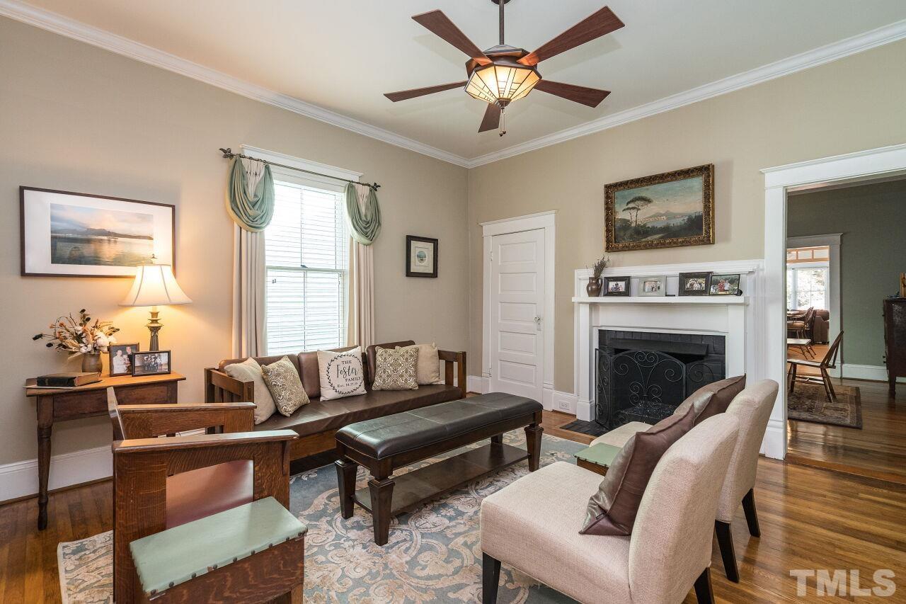1218 Filmore Street Raleigh, NC 27605 - Photo 9 of 38 a living room with furniture and a fireplace