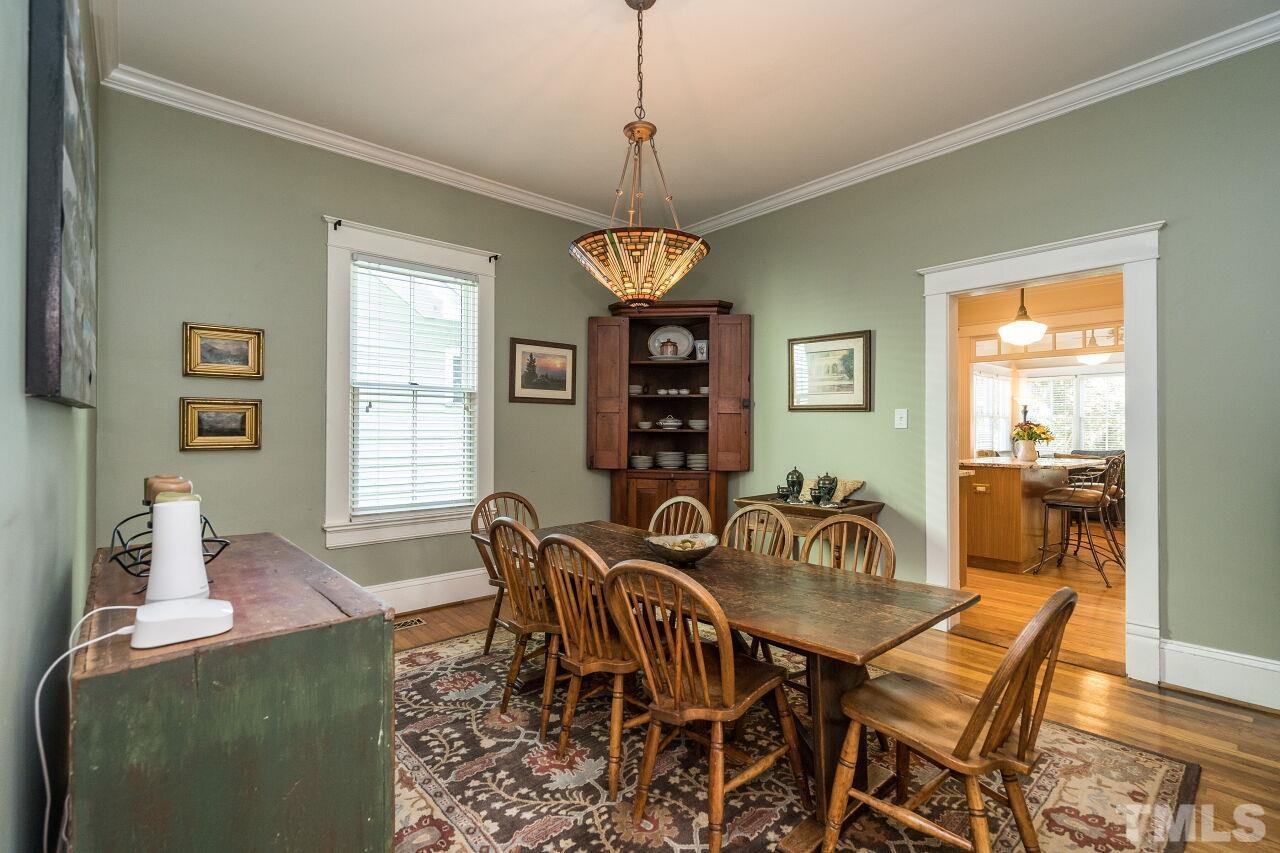 1218 Filmore Street Raleigh, NC 27605 - Photo 10 of 38 a view of a dining room with furniture window and wooden floor