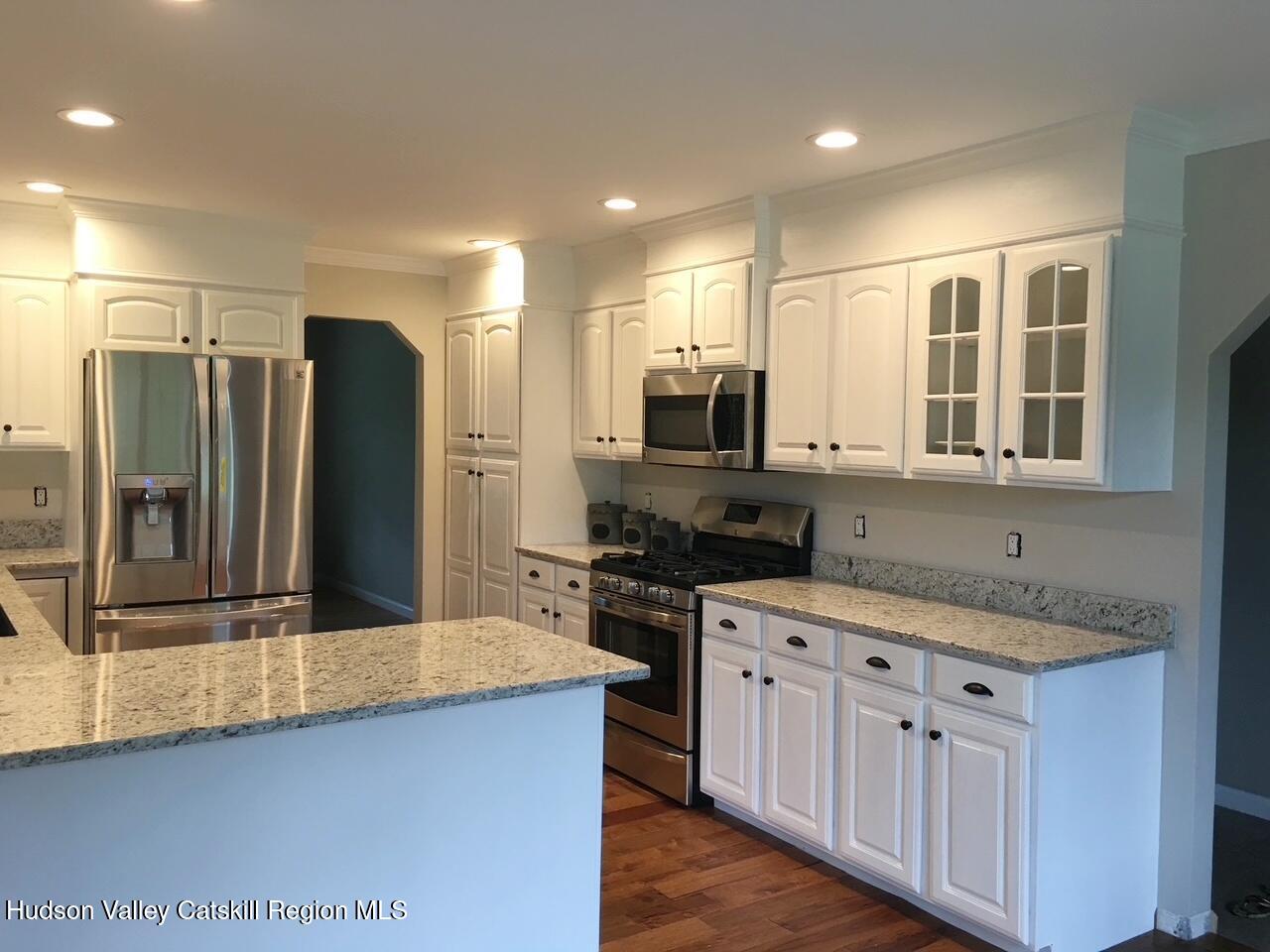 24 Mountain View Road Amenia, NY 12501 - Photo 5 of 13 a kitchen with stainless steel appliances granite countertop a refrigerator a sink a stove a microwave and island