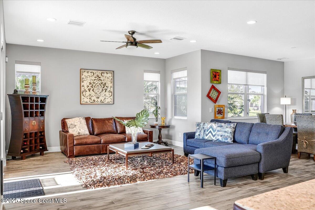 3379 Ribbon Grass Drive Melbourne, FL 32940 - Photo 12 of 62 a living room with furniture and a large window