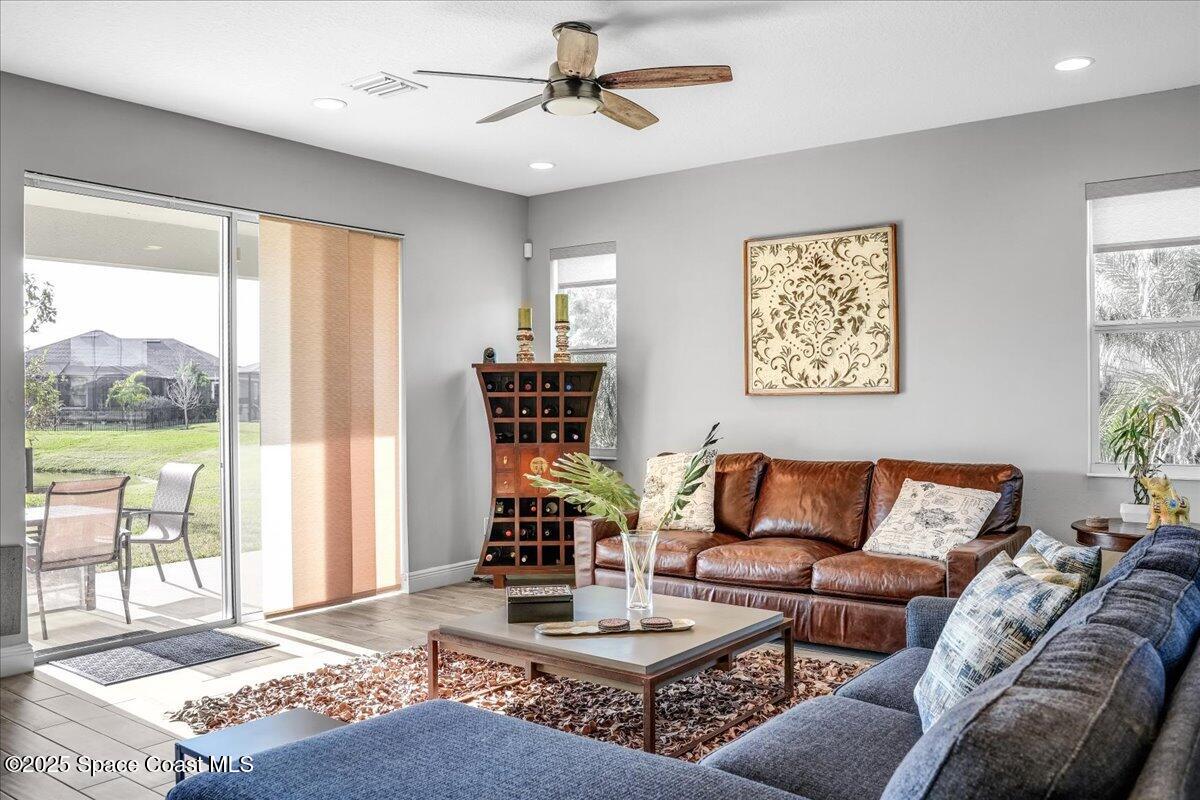 3379 Ribbon Grass Drive Melbourne, FL 32940 - Photo 13 of 62 a living room with furniture and a window