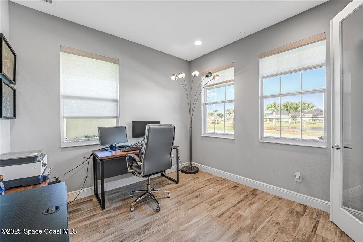 3379 Ribbon Grass Drive Melbourne, FL 32940 - Photo 17 of 62 a view of a workspace with furniture and a window