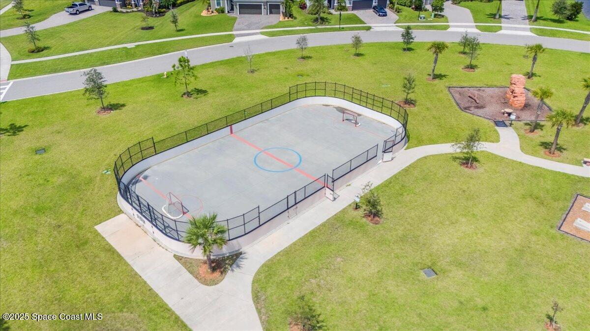 3379 Ribbon Grass Drive Melbourne, FL 32940 - Photo 58 of 62 a view of a swimming pool with a yard