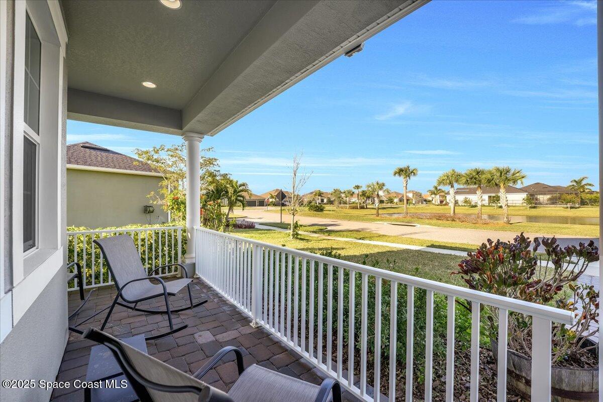 3379 Ribbon Grass Drive Melbourne, FL 32940 - Photo 6 of 62 a view of a chair and tables in the balcony