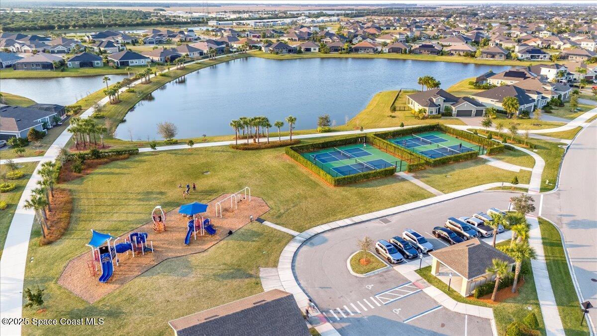 3379 Ribbon Grass Drive Melbourne, FL 32940 - Photo 61 of 62 an aerial view of a swimming pool with outdoor seating