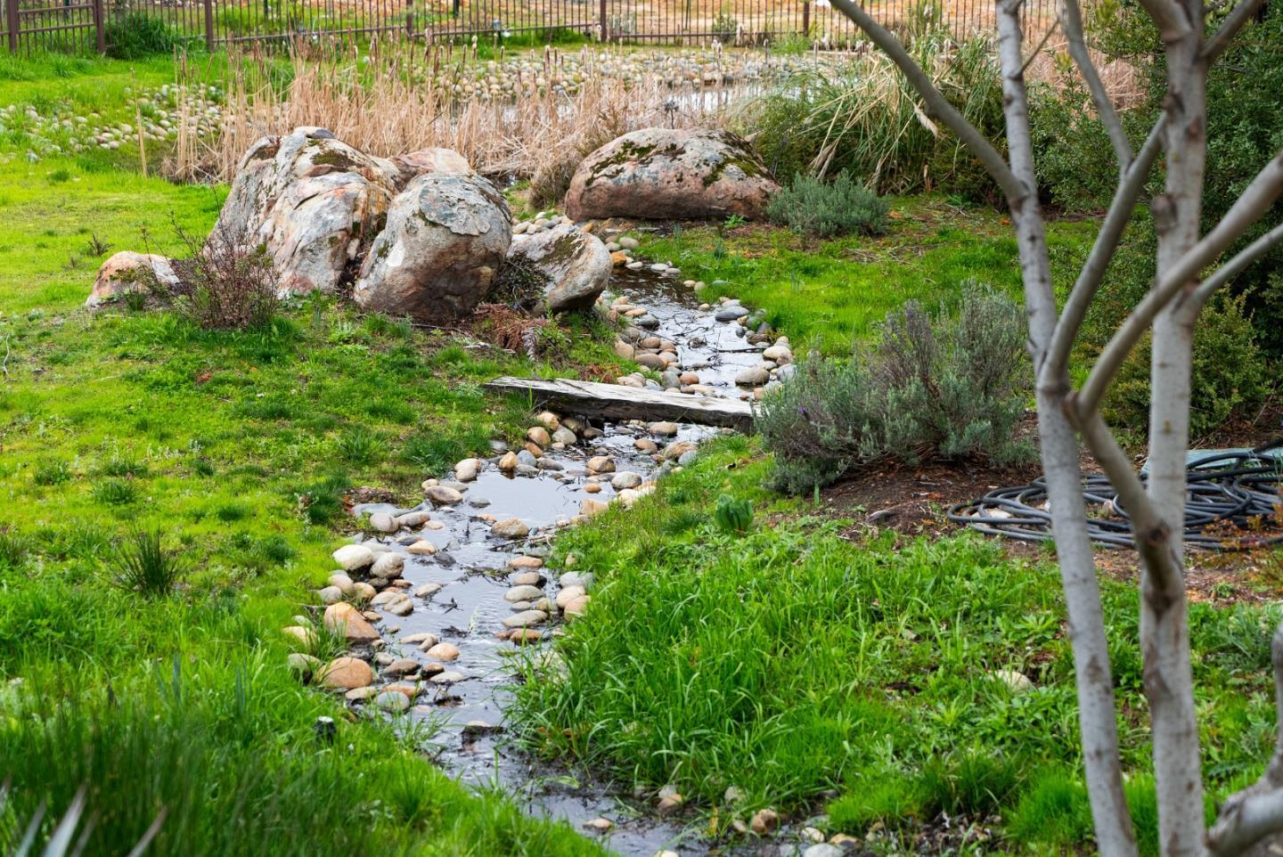 1061 Summit Road Watsonville, CA 95076 - Photo 76 of 83 a view of a garden with a bench