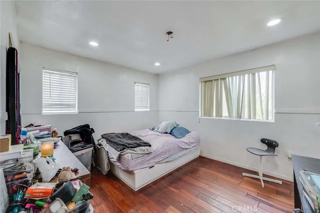 a bedroom with furniture and a window