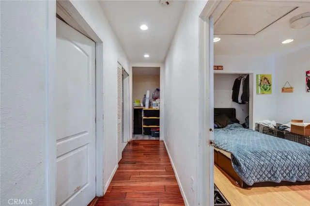 a en suite bathroom with a granite countertop sink and a mirror