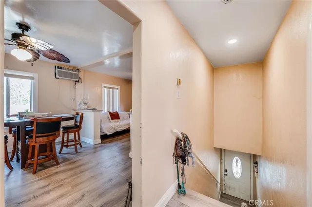 a view of a livingroom with furniture and hardwood floor