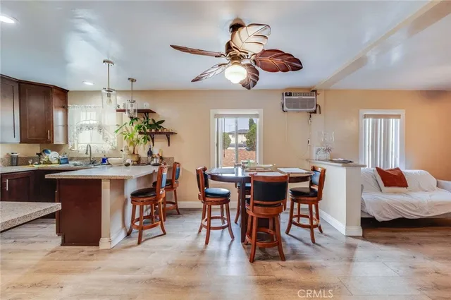 a view of a dining room with furniture and chandelier