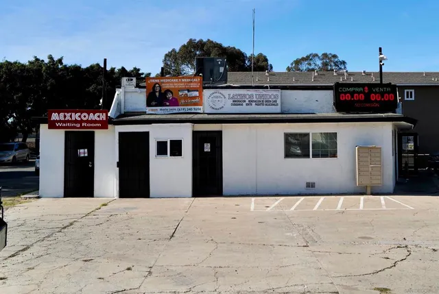 a front view of a building with retail shops