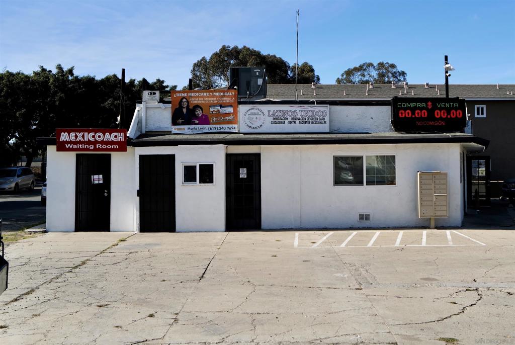 4635 Border Village Road San Ysidro, CA 92173 - Photo 2 of 3 a front view of a building with retail shops