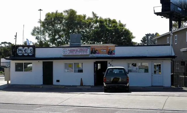 a front view of a house with parking space