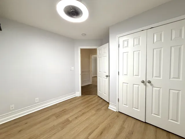 a view of a livingroom with wooden floor