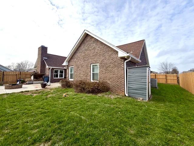 a view of a house with a yard porch and sitting area