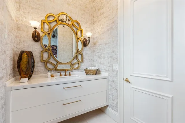 a dining room with furniture a chandelier and wooden floor