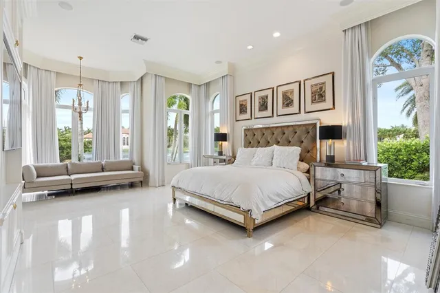 a bathroom with a toilet sink vanity and mirror