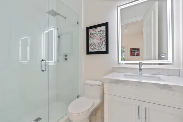 a dining room with furniture and a floor to ceiling window