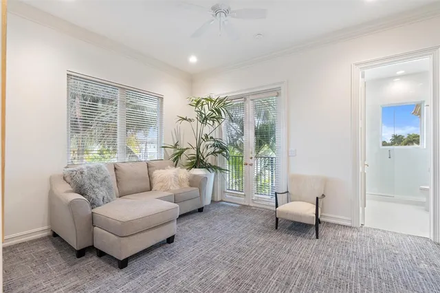 a living room with couches a coffee table and a flat screen tv