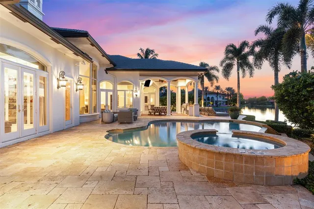 a view of a swimming pool with a lounge chair