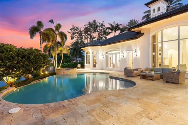 a living room with furniture fireplace and window
