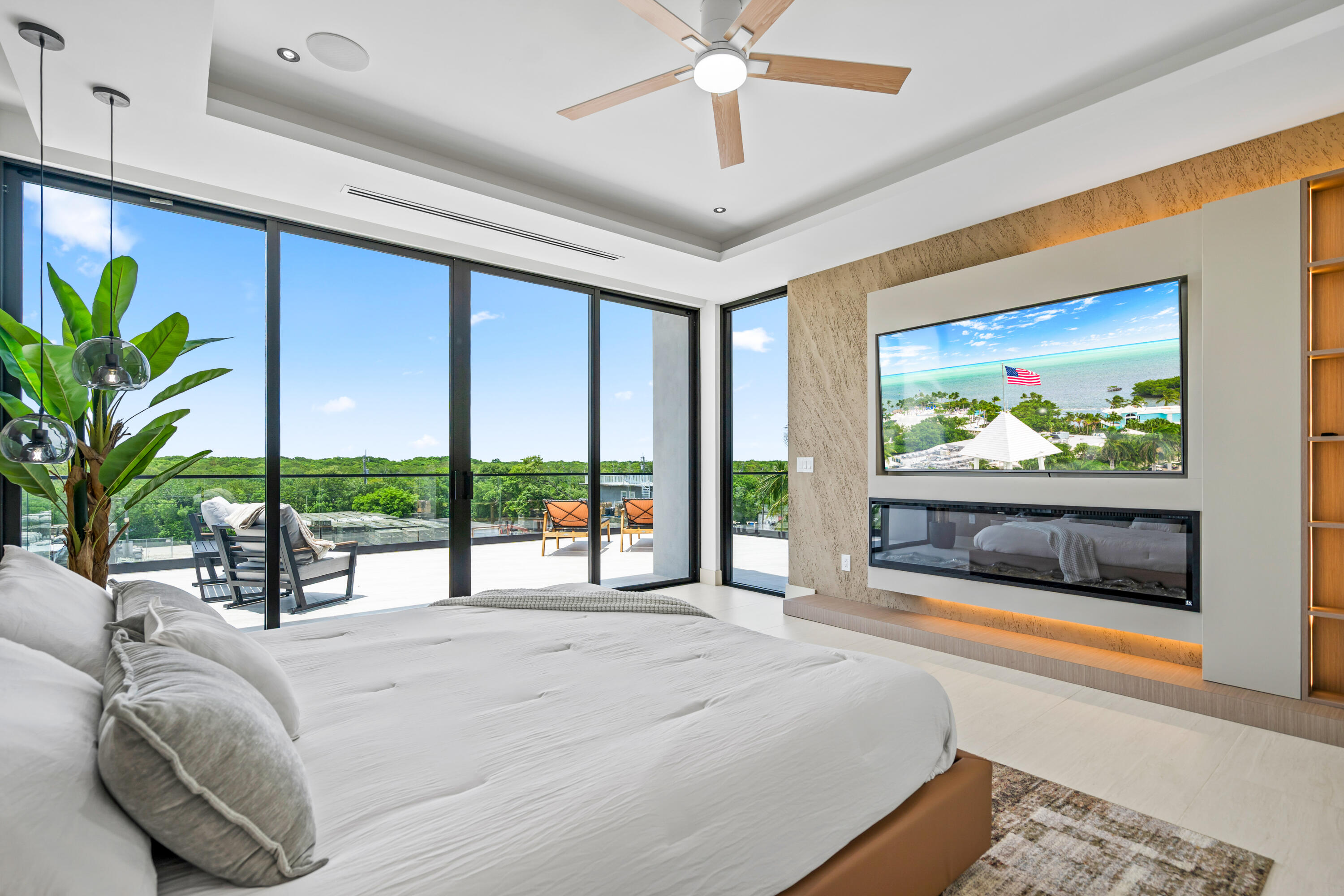 16 South Exuma Road Key Largo, FL 33037 - Photo 28 of 74 a bedroom with a large bed and a large window with the balcony view