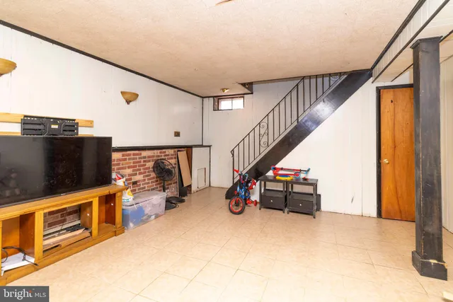 a view of a hallway with seating area