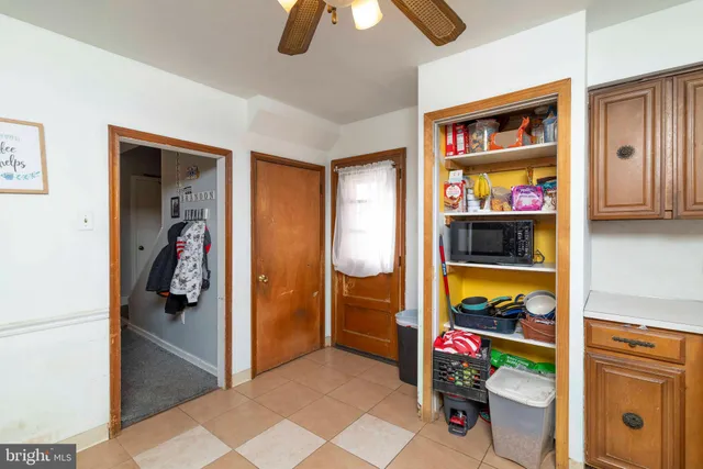 a utility room with closet dryer and washer