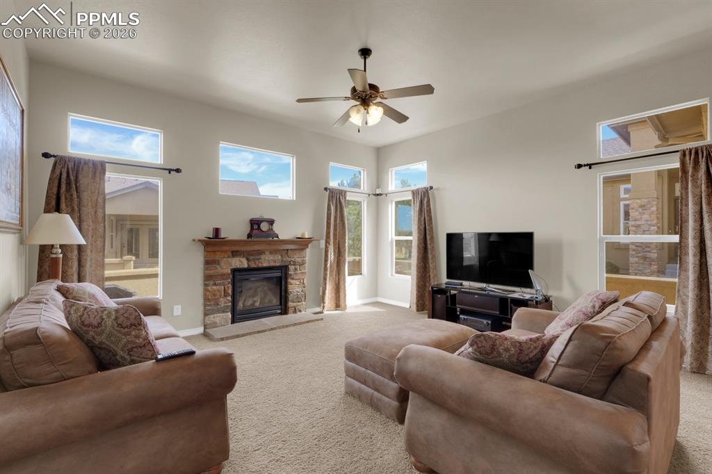 7636 Wichita Ridge Point Colorado Springs, CO 80923 - Photo 9 of 33 Living Room with fireplace